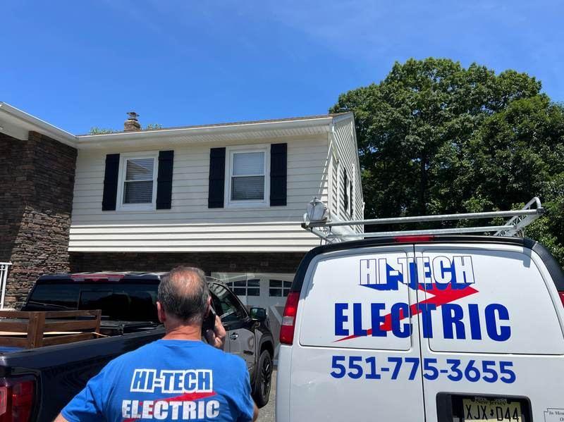 Licensed electrician working on an electrical panel